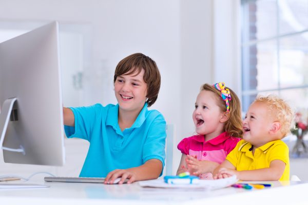 Kids doing homework with modern computer